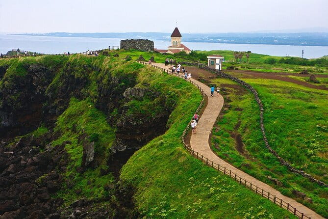 Jeju Eastern Cultural Exploration Day Tour - Seopjikoji: coastal scenery with a screen connection