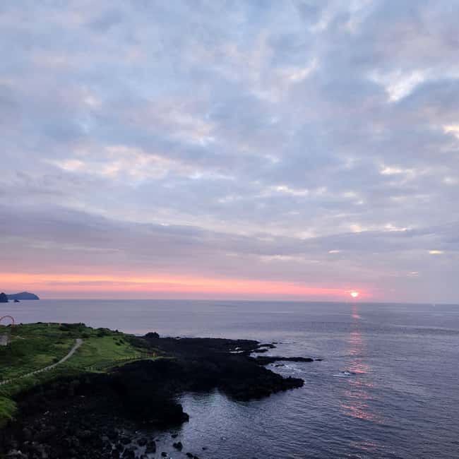 Jeju Island: Sunrise Guided Tour with Hotel Pickup - Walking to the coast before the sun appears