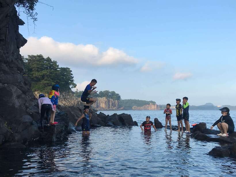 Jeju Island: Van Tour with a Guide Who Most Loves Jeju - Jeongbang Waterfall starts the southern stretch